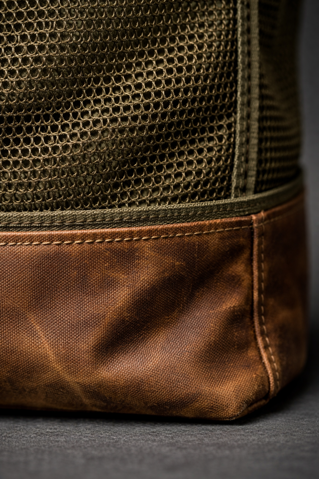 Detail of mesh and waxed canvas construction on foraging bag